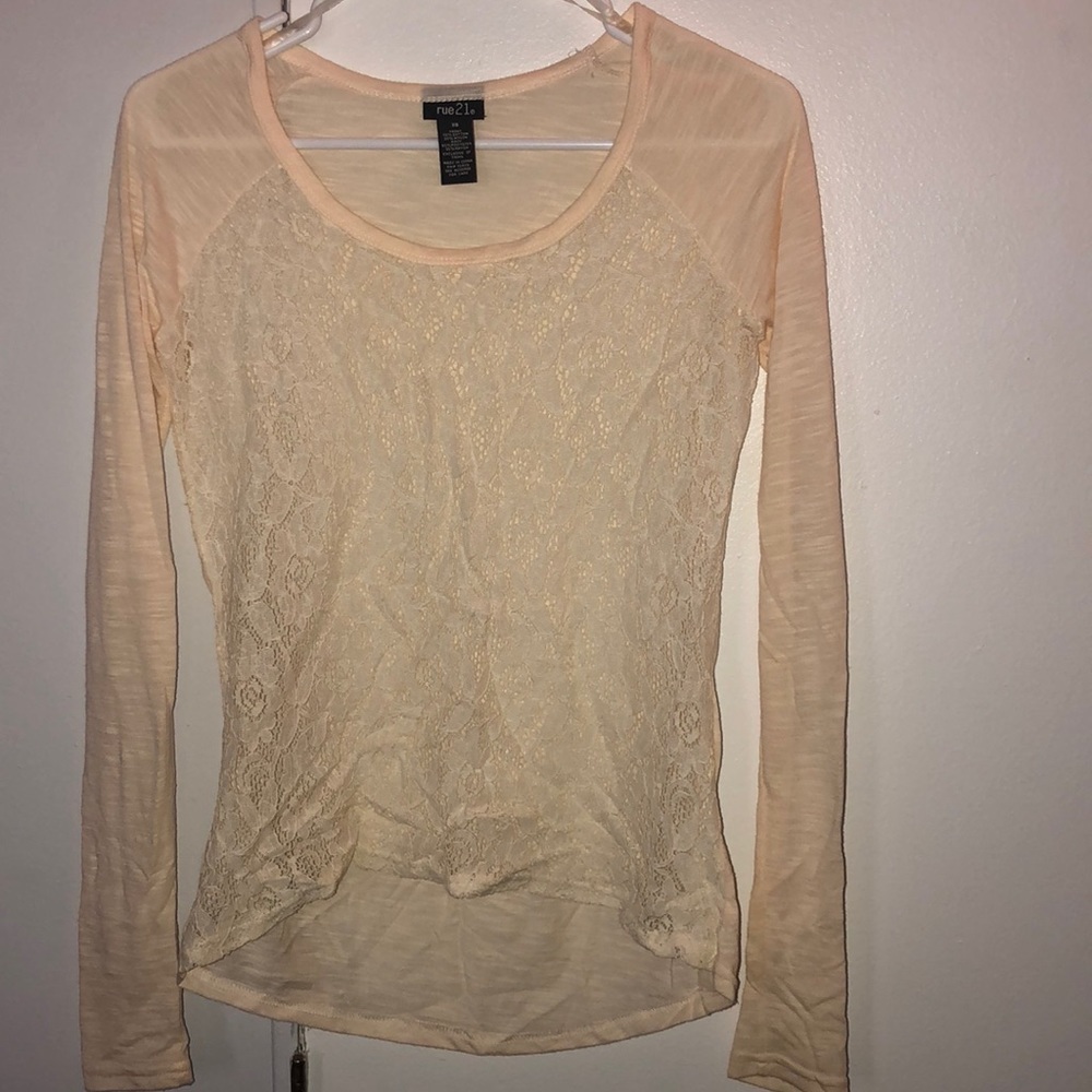 Cream colored long sleeve top